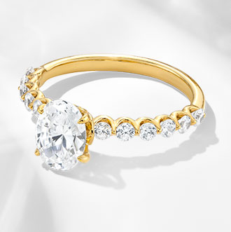 Solitaire with Side Accents - Elevate your solitaire ring with side accents for added sparkle and brilliance.