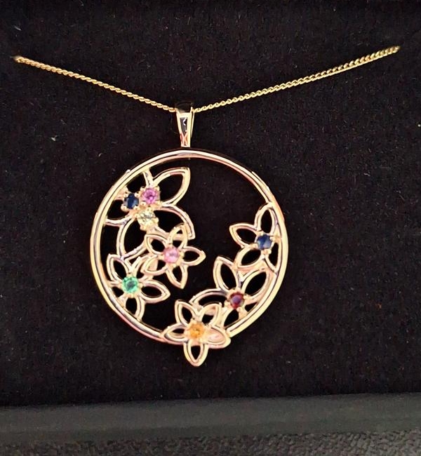 "Nicest family pendant I've seen. Stones are tiny but it still looks great and very dainty. Bought as a gift and she loves it."
