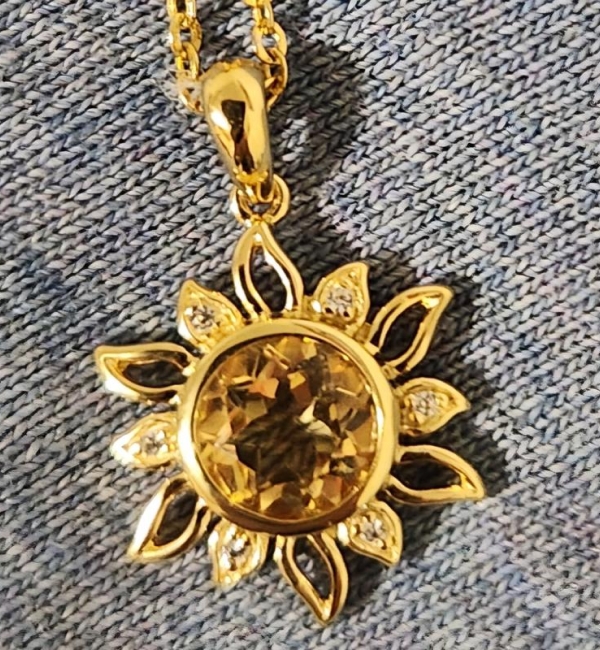 "I love this sun necklace. It's classy, sparkly, bright sunny, and unique. Good quality."		