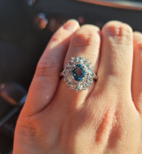 "It shines and sparkles, I get so many compliments. Best engagement ring I could have ever gotten. The ring serves princess Di vibes."		