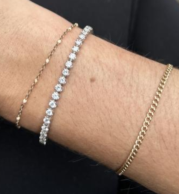 "Absolutely stunning bracelet. The perfect size in my opinion - not too big but not too small! Sterling silver allowed my husband to get my dream tennis bracelet for my milestone 30th birthday and not spend an arm and a leg."	