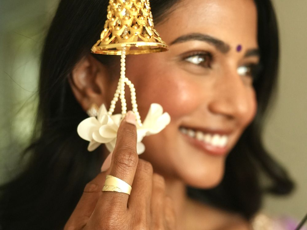 Deya wearing 14K & 18K gold jewellery from Peoples